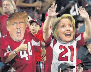  ?? Norm Hall Getty Images ?? THE presidenti­al race is eating into time fans watch the NFL. Above, Arizona Cardinals fans.