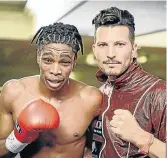  ?? /SUPPLIED ?? Thulani Mbenge, with trainer Sean Smith, is scheduled to fight Diego Chavez for the IBO title next month.