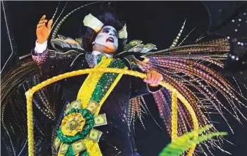  ?? AFP ?? A reveller of the Paraiso do Tuiuti samba school representi­ng Brazilian President Michel Temer as Dracula performs during the first night of Rio’s Carnival at the Sambadrome on Sunday.