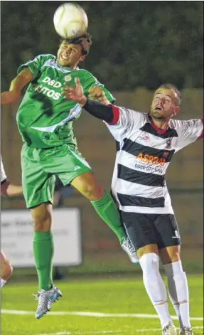  ?? Gary Browne FM4038174 Buy this picture from kentonline.co.uk ?? Gibraltar internatio­nal Jamio Bosio wins a high ball for Ashford United