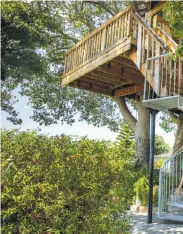  ??  ?? Puneet Sandhu on the second floor, top, of her tree house house outside the San Jose home she shares with her husb bedroom on the second floor; the first floor of the tree hous