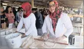  ??  ?? TURKISH DELIGHT: Ayshe Tatar, left, and her mom Fatma Tatar make pastry for the Turkish dish called gozleme.