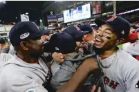  ?? ASSOCIATED PRESS DAVID J. PHILLIPS/ ?? Boston right fielder Mookie Betts, right, celebrates after the Red Sox won the American League Championsh­ip Series against the Astros on Thursday in Houston.