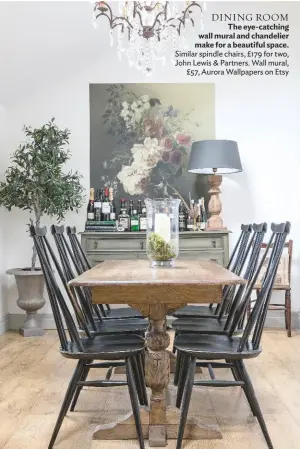  ??  ?? DINING ROOM
The eye-catching wall mural and chandelier make for a beautiful space. Similar spindle chairs, £179 for two, John Lewis & Partners. Wall mural, £57, Aurora Wallpapers on Etsy