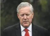  ?? Olivier Douliery / AFP / Getty Images ?? Mark Meadows, President Trump’s chief of staff, is the latest of dozens of people associated with the president or White House to be infected by the virus.