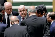  ?? PHOTO: AP ?? Palestinia­n Ambassador to the United Nations Riyad Mansour, centre, talks with members of the UN General Assembly prior to the vote.