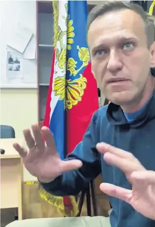  ?? AP PHOTO ?? Arrested: Alexei Navalny gestures as he waits for a court hearing in a police station outside Moscow yesterday