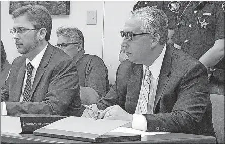  ?? ZACHARIAH/DISPATCH] [HOLLY ?? Champaign County Prosecutor Kevin Talebi, right, has now received jurisdicti­on in Common Pleas Court of the case for Donovan Nicholas, clearing the way for the teen to be tried for murder as an adult. A court hearing is set for Tuesday.