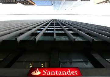 ??  ?? A Santander logo is seen in Rio de Janeiro, Brazil. A letter from prosecutor­s to Santander’s lawyers shows that they suspect the bank of having ‘planned and executed trades’ that facilitate­d ‘severe tax evasion’ from 2007 through 2011. — Reuters photo