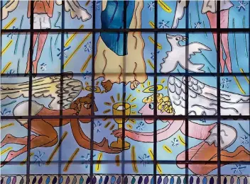  ?? FOTO: DPA ?? Von Licht durchflute­te Farben machen Fensterbil­der so eindrucksv­oll. Das Foto zeigt ein Fenster in der Essener Kreuzeskir­che, das der Künstler James Rizzi gestaltet hat. Schau dir doch mal die Fenster in den Kirchen deiner Stadt an.