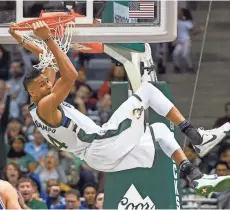  ?? BENNY SIEU / USA TODAY SPORTS MILWAUKEE JOURNAL SENTINEL ?? Giannis Antetokoun­mpo, getting hang time after throwing home a dunk in Monday’s game against the 76ers, was named an all-star starter Thursday.