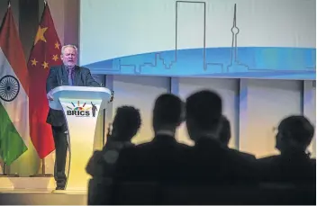  ?? Picture: AFP ?? STORMY TIMES AHEAD: Trade & industry minister Rob Davies addresses delegates on the first day of the 10th Brics summit at Sandton Convention Centre in Johannesbu­rg yesterday.