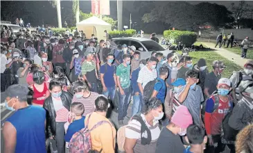  ?? REUTERS ?? Hondurans gather outside a bus station before taking part in a new caravan of migrants, that was set to head to the United States, in San Pedro Sula, Honduras on Thursday.