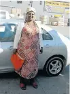  ??  ?? Nompumelel­o Jaji with her Toyota Yaris that turned out to be illegal.