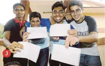  ?? PIC BY DANIALD SAAD ?? 3. Friennds (from left) Y. Edwin, S. Prasshaant­h, Muhammad Izzudin Syed Husseinn and Sandeep Singh Gill of SM Bukit JJambul showing their SPM result slips. TThe four are among five in Penangg who scored A+ in all subjects.