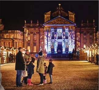  ??  ?? BEAMING: Smiling Anna, eight, and Christmas display at Blenheim