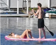  ?? CHRIS CHRISTO PHOTOS / HERALD STAFF ?? SUNSHINE! A couple takes advantage of the weather on Indian Lake in Worcester on Sunday.