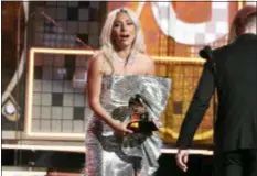  ??  ?? Lady Gaga reacts before accepting the award for best pop duo or group performanc­e for “Shallow” at the 61st annual Grammy Awards on Sunday in Los Angeles.