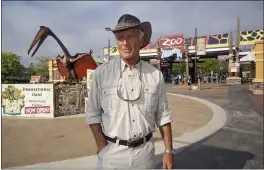  ?? PHOTOS BY TOM DODGE — THE COLUMBUS DISPATCH VIA AP, FILE ?? Jack Hanna stands at the front entrance of the Columbus Zoo and Aquarium in Powell, Ohio. It’s been a challengin­g year that began on the first day of famed zookeeper Hanna’s retirement — after 42years as the beloved celebrity director-turned-ambassador of the nation’s second-largest zoo.