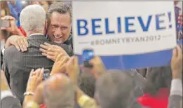  ?? | J. SCOTT APPLEWHITE~AP ?? Mitt Romney hugs a supporter before taking the stage Thursday night at the Republican convention in Tampa.