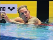  ?? /AFP ?? Making a splash: US swimmer Caeleb Dressel checks the clock after the 100m butterfly final in Tokyo.