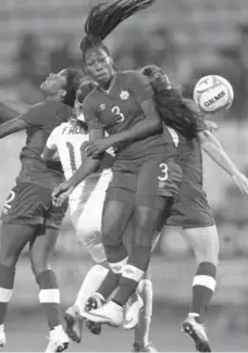  ?? PETROS KARADJIAS/THE ASSOCIATED PRESS FILE PHOTO ?? Canadian teammates Ashley Lawrence, left, Kadeisha Buchanan, centre, and Allysha Chapman, right, close ranks in a March match.