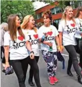  ??  ?? Women wearing I Love MCR T-shirts arrive at the Old Trafford Cricket Ground ahead of the One Love Manchester tribute concert in Manchester on June 4, 2017.