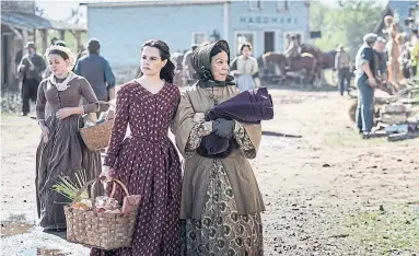  ?? CHRIS REARDON PHOTOS EPIX ?? “Schitt’s Creek” star Emily Hampshire, centre left, traded plaid shirts for corsets in the gothic horror series “Chapelwait­e.”