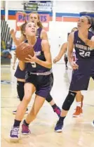  ?? PAUL W. GILLESPIE/BALTIMORE SUN MEDIA GROUP ?? Severna Park’s Rachel Spilker drives toward the basket in the second quarter of the Falcons’ 43-38 victory Tuesday. Spilker scored five points and added three assists.