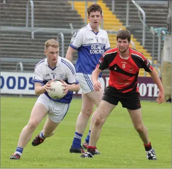  ??  ?? Ballyhogue’s Shane Doyle in action against Art Sweetman of Bannow-Ballymitty at InnovateWe­xford Park.