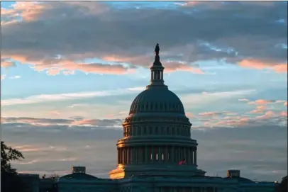  ?? The Associated Press ?? TO-DO LIST: The U.S. Capitol in Washington at sunrise on June 20. Keep the government running and confirming Brett Kavanaugh as the next Supreme Court justice. Those are the big-ticket items that Republican leaders in Congress hope to accomplish as lawmakers look to wrap up their work in 2018 and head home to campaign for the November elections.