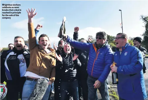  ??  ?? Wrightbus workers celebrate as news breaks that a deal is reached in principle for the sale of the company