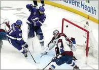  ?? CHRIS O’MEARA / AP ?? Tampa Bay Lightning left wing Pat Maroon (14) scores past Colorado Avalanche goaltender Darcy Kuemper (35) during the second period of Game 3 of the NHL hockey Stanley Cup Final on Monday in Tampa, Fla.