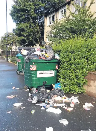  ??  ?? Pictured is overlfowin­g bins at Douglas following the roll out of the new service.