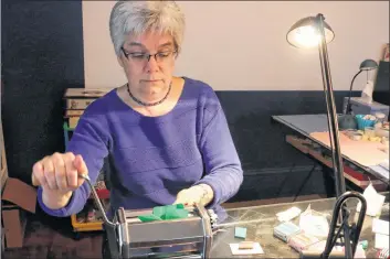  ?? CAROLE MORRIS-UNDERHILL ?? Karen Price’s pasta maker has never made pasta — but it’s sure been well-used. The machine helps Price create oneof-a-kind pieces using polymer clay.