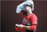  ?? LYNNE SLADKY — THE ASSOCIATED PRESS ?? Philadelph­ia Phillies pitcher Pat Neshek cools down in the bullpen during the team’s spring training camp in Clearwater, Fla.