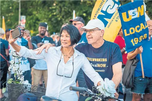  ??  ?? Former NDP MP Olivia Chow takes a selfie with longtime friend and former colleague Bob Gallagher at the 2016 Labour Day parade in Toronto.