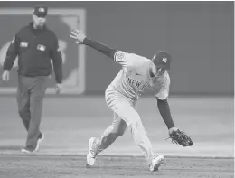  ?? JULIO CORTEZ/AP ?? Yankees shortstop Isiah Kiner-falefa fields a ground ball hit by the Orioles’ Anthony Santander during the sixth inning of a game April 15 in Baltimore.