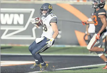  ?? PHOTOS BY AMANDA LOMAN — THE ASSOCIATED PRESS ?? Cal running back Patrick Laird crosses the goal line for a 30-yard touchdown run during Saturday’s 49-7 victory.