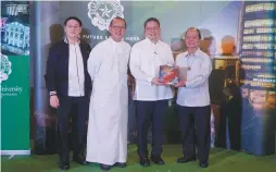  ??  ?? Fr. Jett Villarin, S.J. (second from right), president of the Ateneo de Manila University (ADMU), receives the first copy of SiyaNga!Reflection­swithArt from Br. Raymundo Suplido, FSC (right), president of De La Salle University (DLSU) during the book’s launch at the DLSU’s Henry Sy Sr. Hall on January 28. With them are Dr. David Jonathan Bayot (far left), executive publisher of the DLSU Publishing House, and DLSU Chancellor Br. Bernie Oca, FSC.