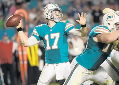  ?? JIM RASSOL/STAFF FILE PHOTO ?? The Dolphins’ Ryan Tannehill will be the 11th-highest-paid quarterbac­k in the NFL this season, having compiled a 37-40 record since 2012. He’s returning to the lineup after recovering from a knee injury that caused him to miss 20 games.