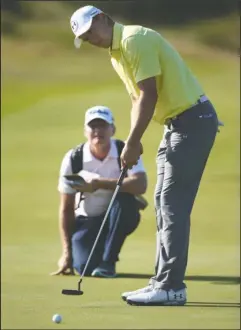  ?? The Associated Press ?? OPEN SEASON: American Jordan Spieth putts at No. 4 during a practice round for the British Open Tuesday at Royal Birkdale in Southport, England. Spieth won the Masters and U.S. Open in 2015, missing by one shot a British Open playoff won by Zach Johnson.