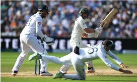  ?? Photograph: Shaun Botterill/Getty Images ?? ▲ Jonny Bairstow (left) looks on as Marnus Labuschagn­e plays a shot during day four of the first Ashes Test.
