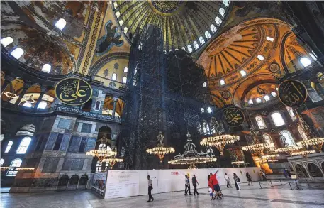  ?? AFP ?? ■
Tourists at the Hagia Sophia in Istanbul yesterday. The nearly 1,500-year-old monument is revered by Muslims and Christians.