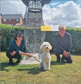  ??  ?? Patricia and Kenneth Gibson with Holly the poodle at the Dogs Trust in Glasgow.