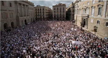  ??  ?? Thousands gathered in a call for dialogue amid a political crisis caused by Catalonia’s secession push in Sant Jaume square in Barcelona, Spain, on Saturday.