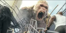  ?? Warner Bros. Entertainm­ent Inc. ?? Naomie Harris as Dr. Kate Caldwell, Jason Liles as George the gorilla and Dwayne Johnson as Davis Okoye in “Rampage.”