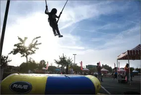  ?? RECORDER PHOTO BY CHIEKO HARA ?? Eliana Lopez, 6, jumps high in the air Friday, Nov. 2, 2018 at Sierra View Medical Center’s employee appreciati­on carnival.