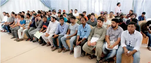  ?? Photos by M. Sajjad ?? Amnesty-seekers wait for their turn at the GDRFA-Sharjah. Those who have criminal cases cannot utilise the amnesty programme. —