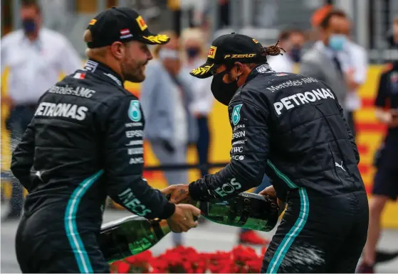  ?? FOTO: LEONHARD FOEGER/LEHTIKUVA-AFP ?? Den perfekta duon kallar Mercedes stallchef Toto Wolff firma Bottas&Hamilton.
■